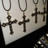 Cross necklaces and studded cuffs / bracelets.